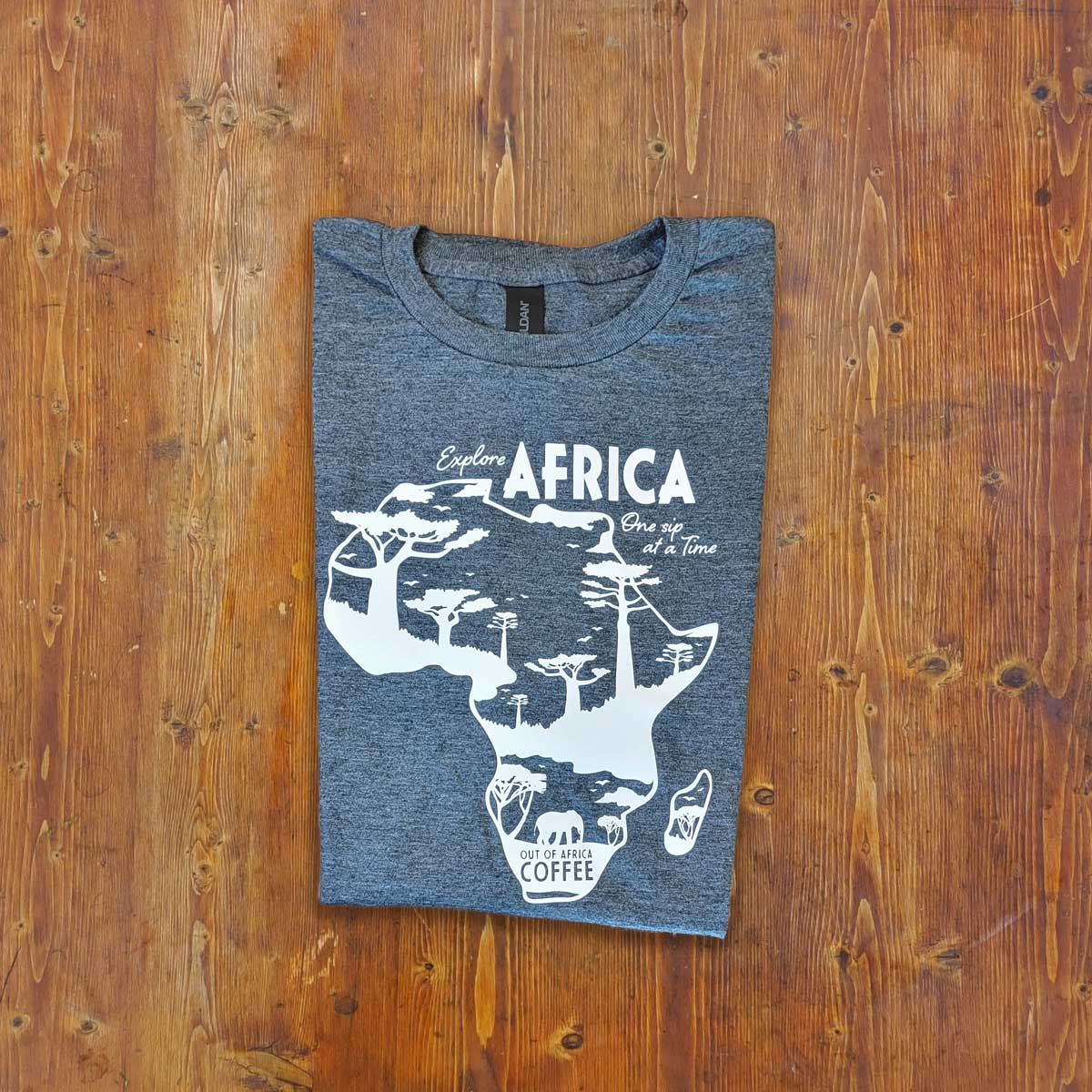 Heathered Grey T-Shirt with "Explore Africa One Sip at a Time" in white with African continent on the front - folded